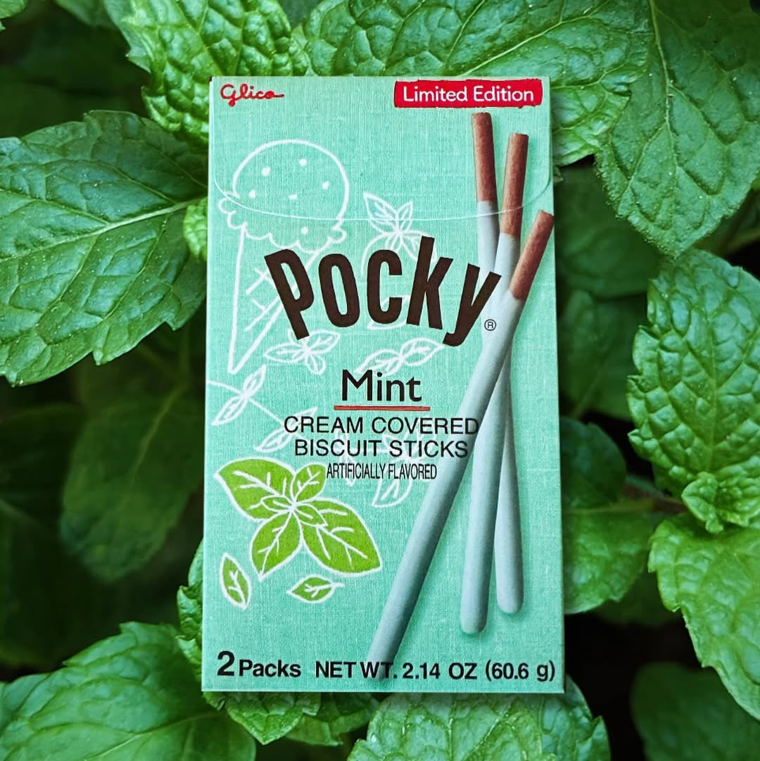 Pocky Mint cream covered biscuit sticks packaging with mint leaves in the background