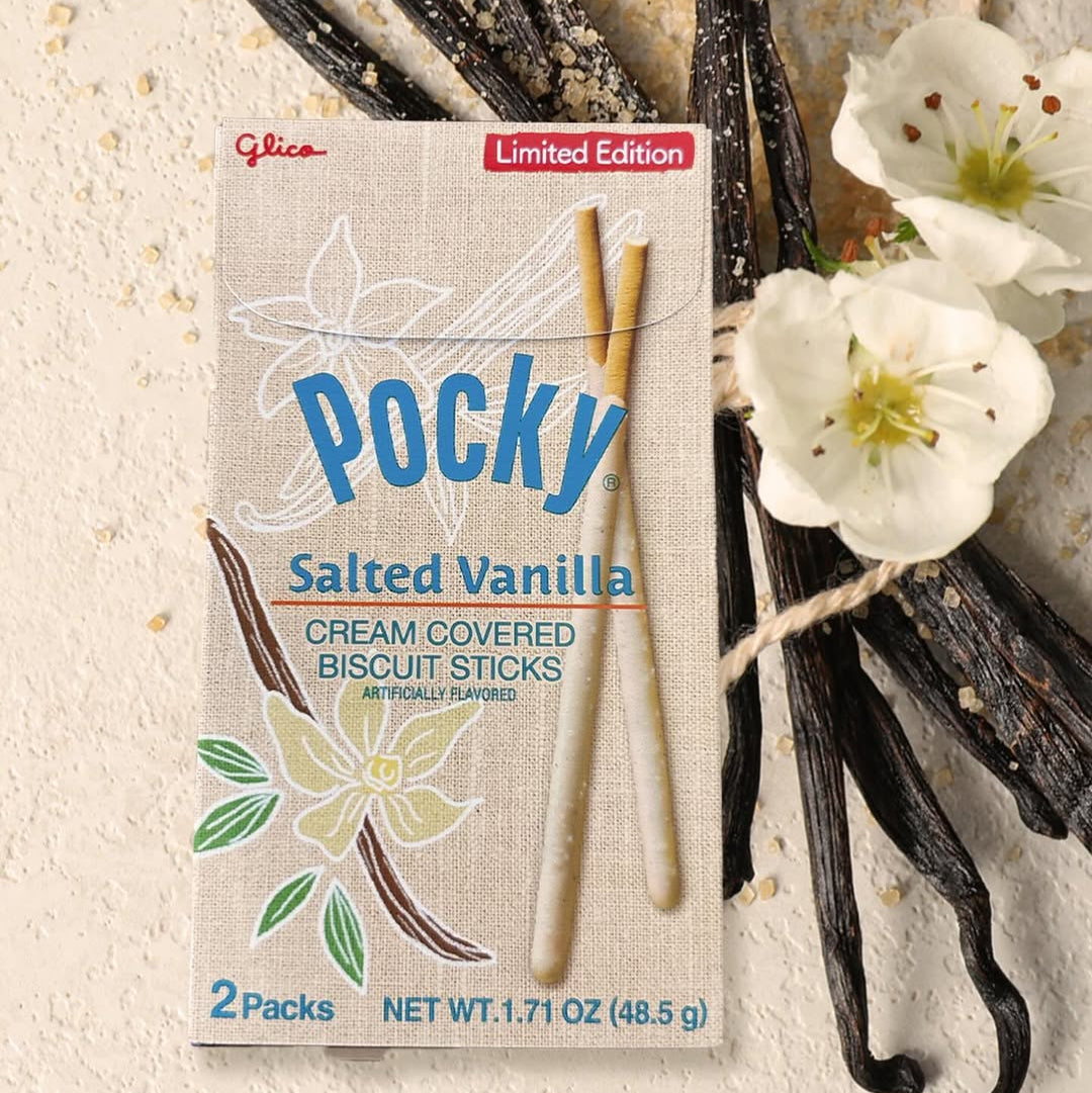 Pocky Salted Vanilla packaging with vanilla beans and flowers on a textured background