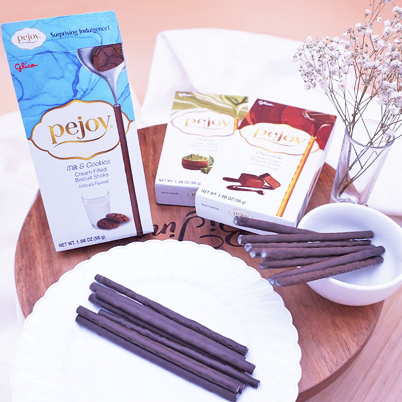A box of Pejoy Milk & Cookies, Chocolate, and Matcha on a wooden tray.