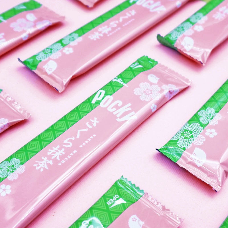 Pocky Cherry Blossom Matcha pouches on pink background