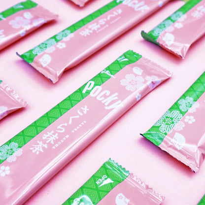 Pocky Cherry Blossom Matcha pouches on pink background