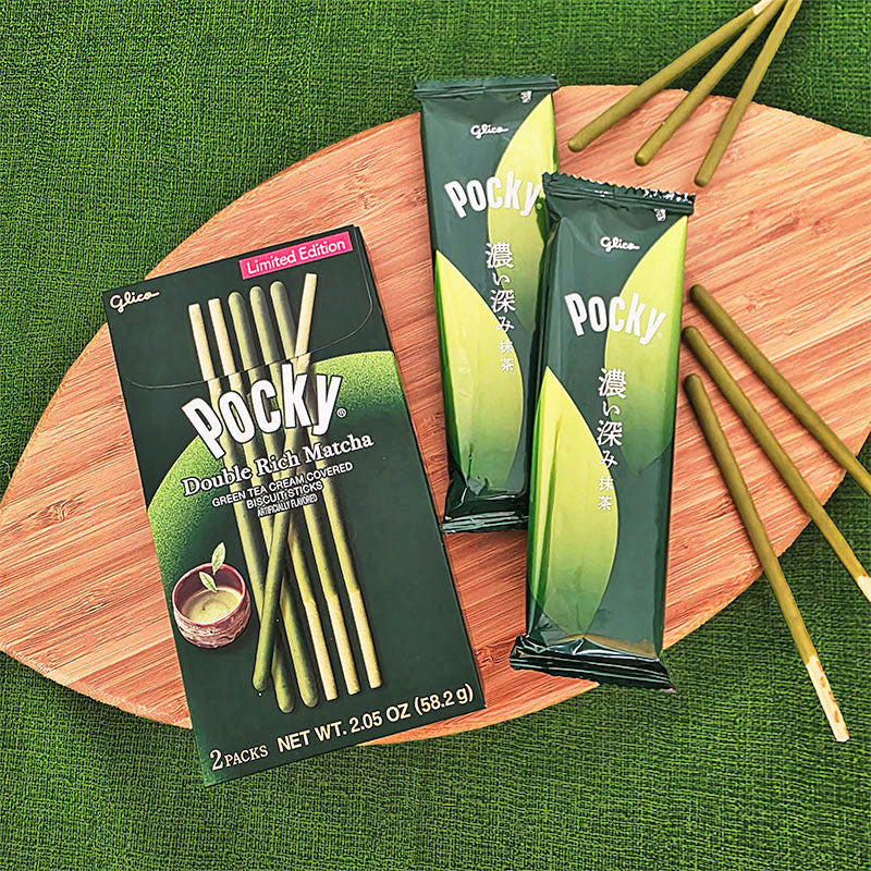 Pocky Double Rich Matcha packaging, inner pouches, and sticks on a wooden board