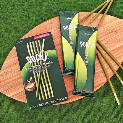 Pocky Double Rich Matcha packaging, inner pouches, and sticks on a wooden board
